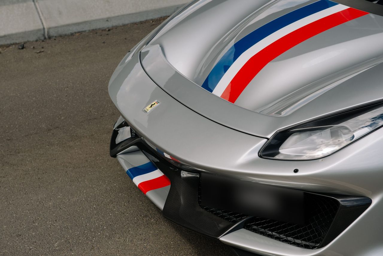 Close-up of the Ferrari 488 Pista's nose, with the stripe running over the bonnet and splitter