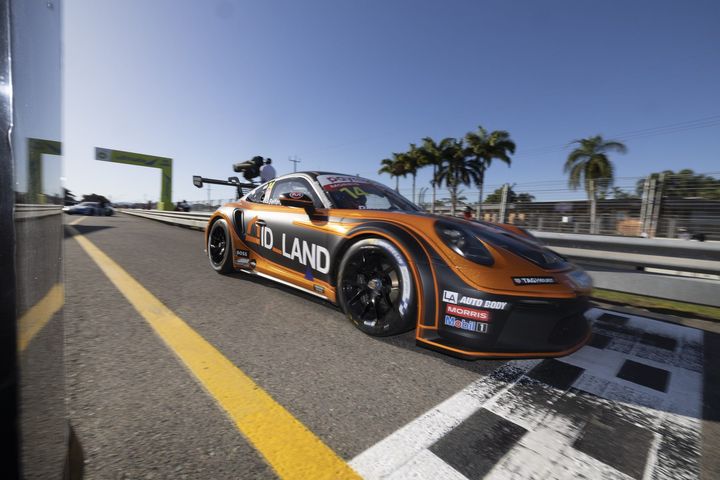 Porsche Cup race car in an orange and black livery
