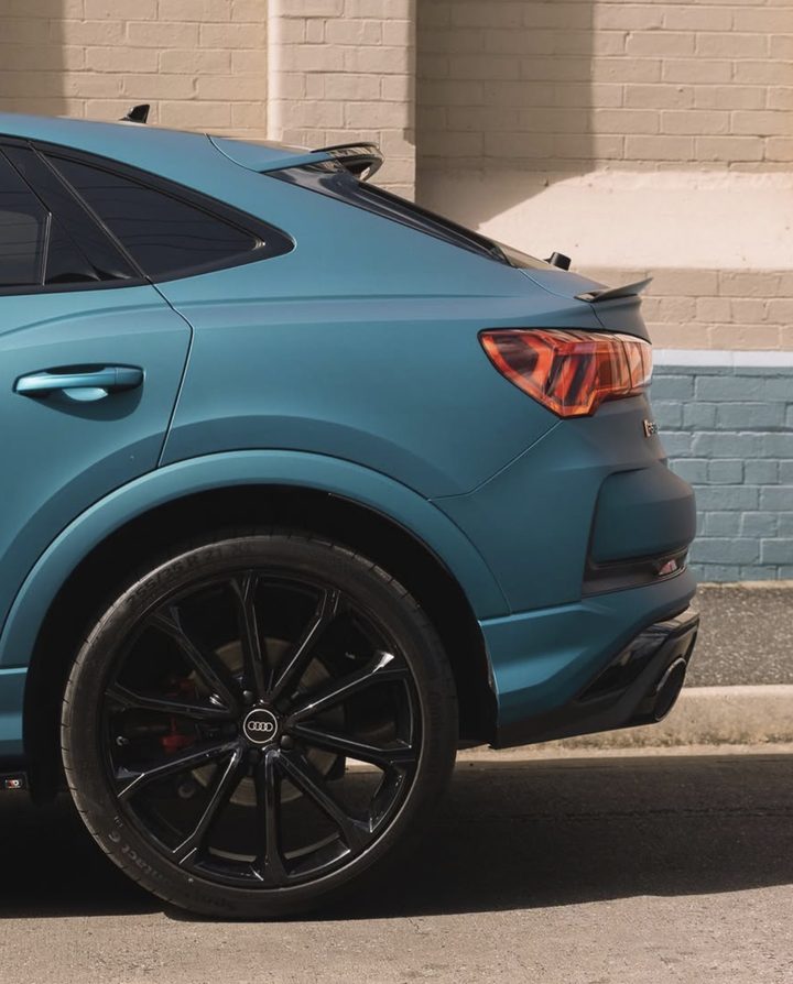 Audi RS Q3 Sportback in a matte teal wrap, rear guard and tail light
